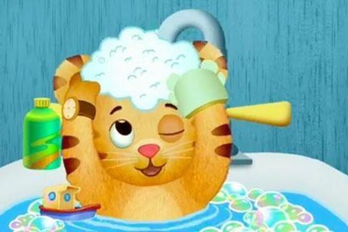 Dad starts the bedtime routine by giving Daniel his bubble bath.