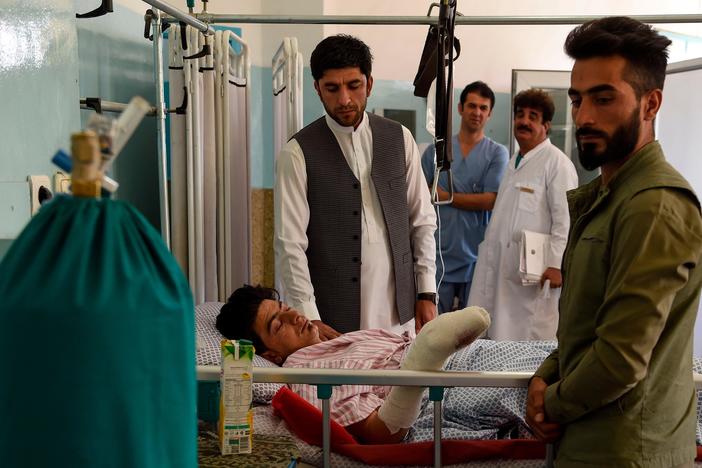 News Wrap: Afghans mourn victims of wedding bombing
