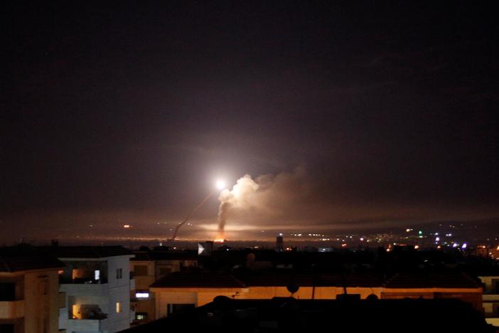 Israel answers Iranian rockets with airstrikes, raising escalation fears