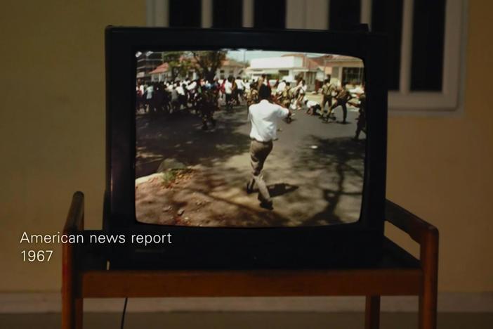 Adi looks at a NBC news report.