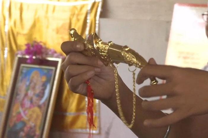 The girls at the Durga Vahini camp are given daggers at the end of the session.