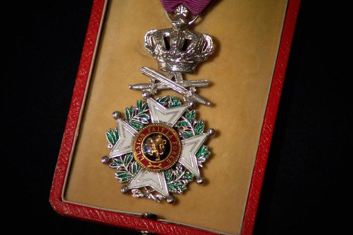 How did John Goularte, Sr. earn this prestigious medal from the Belgian government?