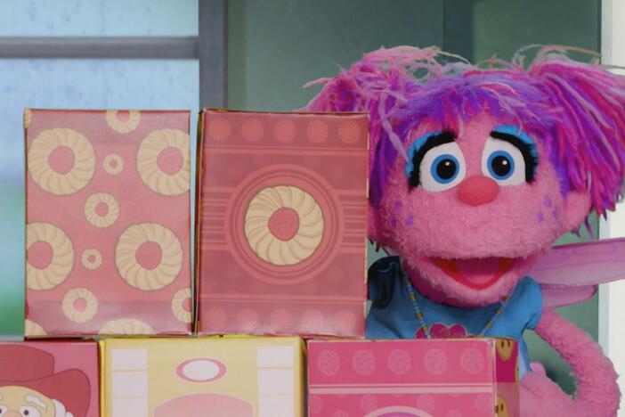 It’s raining, and Elmo, Abby, and Rudy can’t go to the carnival anymore.