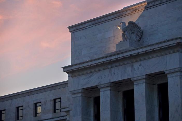 News Wrap: Fed raises interest rate, warns against drawn-out trade war