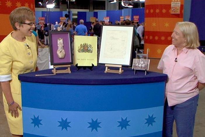 Kathleen Guzman looks at a collection of Dame Margot Fonteyn ballet memorabilia.