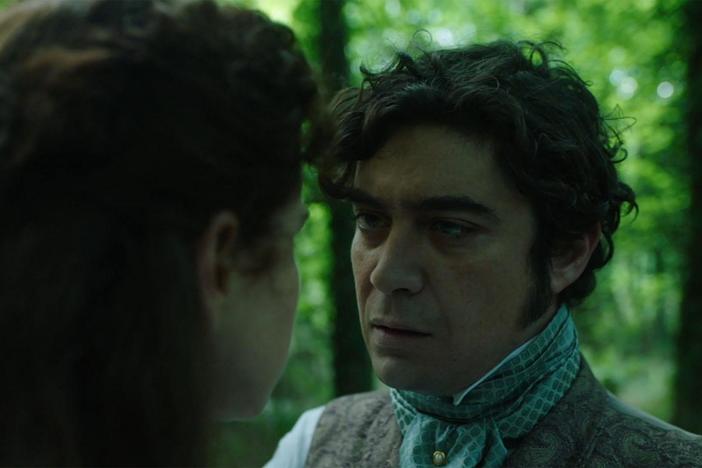 Marian is walking in the woods and Count Fosco follows her.