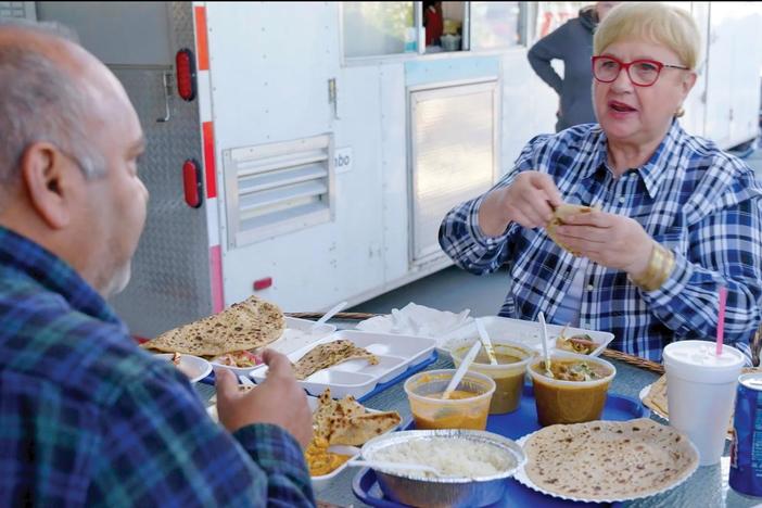Lidia enjoys authentic Punjabi dishes at a roadside truck stop in Bakersfield, CA.