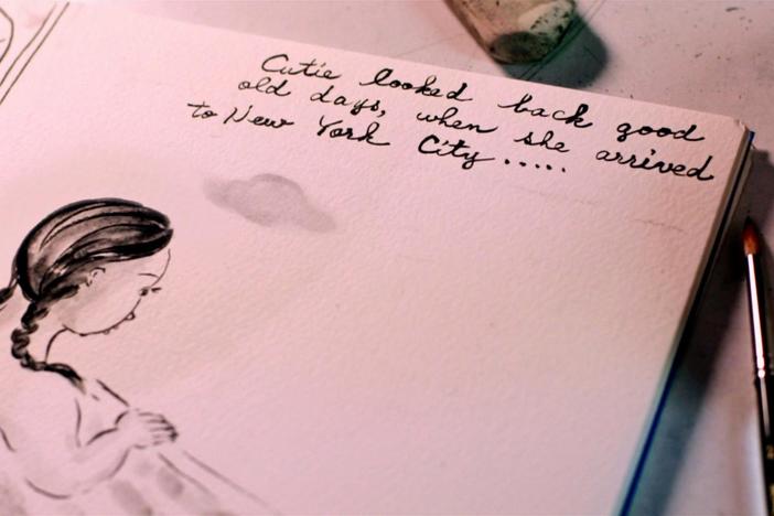 Noriko is working on her illustrations at the studio.