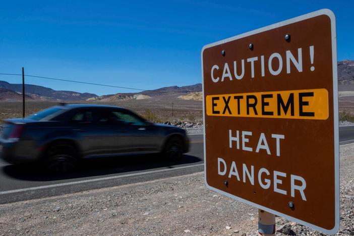 Deadly flooding hits Northeast as heat wave tightens grip on western and southern U.S.