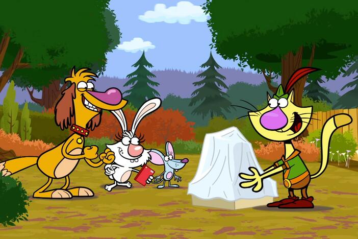 Nature cat unveils a statue of himself made out of acorns. 