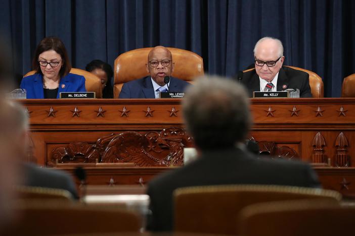News Wrap: House panel debates forcing Trump to disclose his tax returns