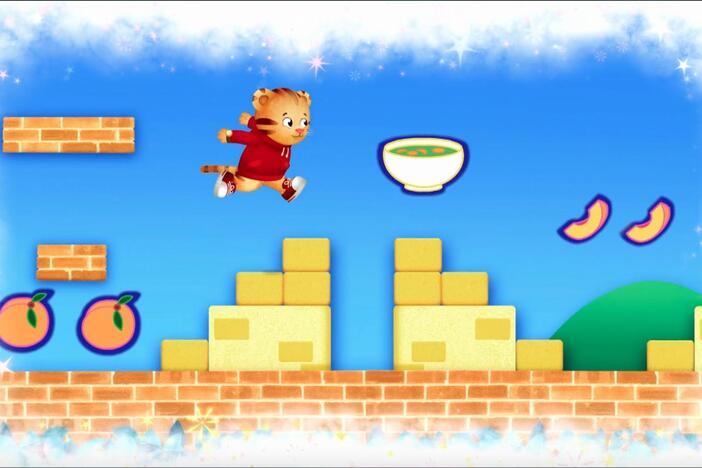 Daniel makes believe he is in the middle of a game where needs to avoid peaches.