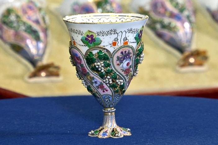 Peter Shemonsky appraises a set of Swiss enameled and pearl coffee cups.
