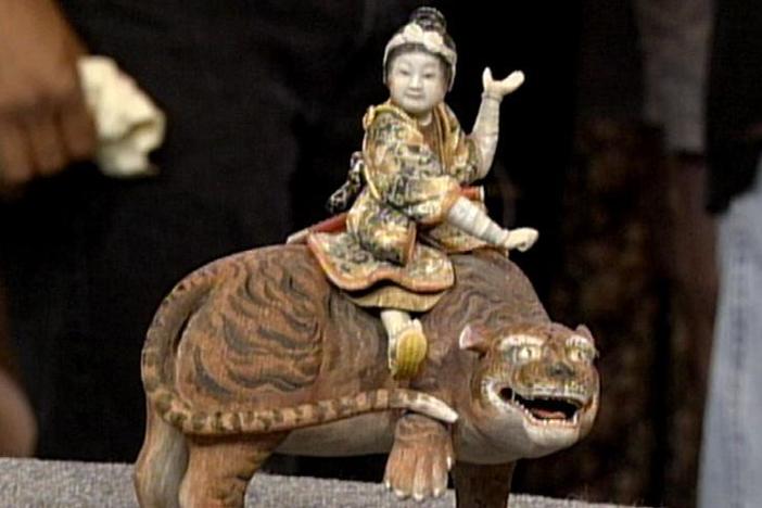 Marvin Sokolow appraises a Meiji period samurai tiger in Vintage Milwaukee.