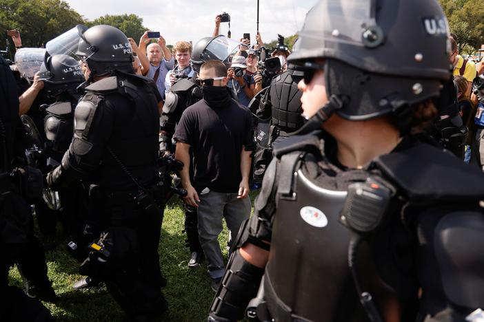 Pro-insurrectionists gather for a small, short rally at Capitol Hill