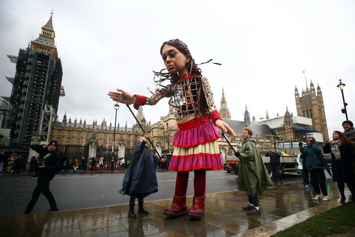 Twelve-foot puppet walks streets of New York to raise awareness of global refugee crisis