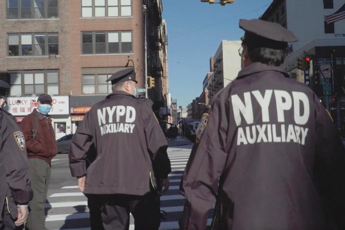 The volunteers of Chinatown's auxiliary police patrol the neighborhood to protect and serve.