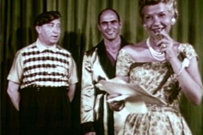 Wise emcees a men's fashion show during the '57 Jubilee and grants a Chicago woman's wish.