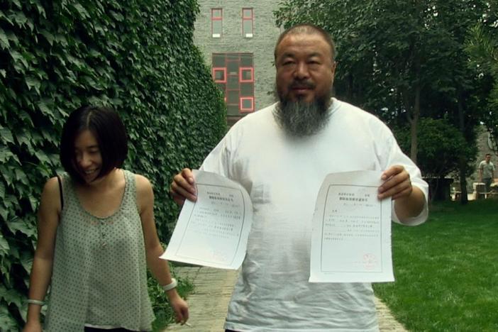Ai Weiwei's probation ends, but the authorities don't give him his passport.