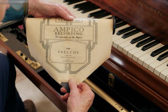 Using an Ampico piano scroll, Scott Yoo watches Rachmaninoff play the piano.
