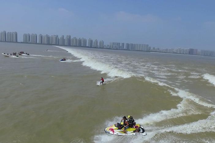 In Hangzhou Bay, brave surfers wait for the annual return of an ancient sea monster.