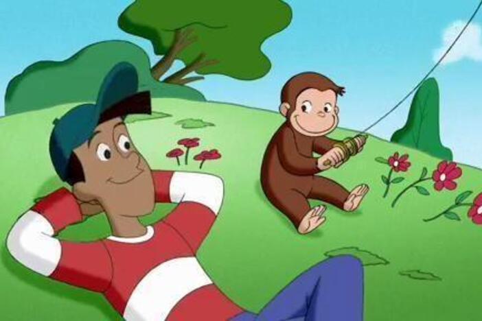 On a beautiful day, George and Bill observe wind patterns as they fly a kite together.