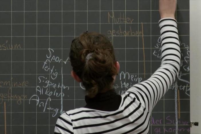 The clip starts with Nazlije writing a timeline. It ends with her talking to her friends.