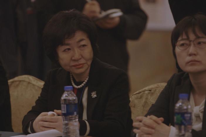 Grandma Gil tells her story in more detail to a group of Chinese women at a conference.