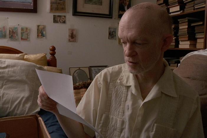 Mark Landis looks through letters he's received from museums and galleries.