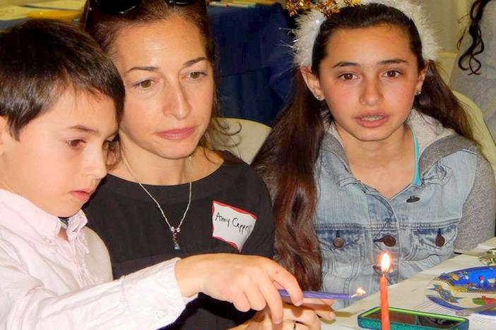 Can families successfully observe the religious traditions of more than one faith?