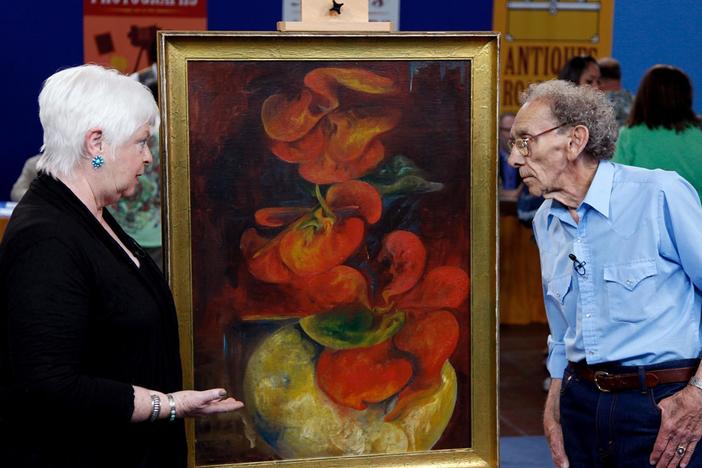 Kathleen Harwood appraises a painting by Zelda Fitzgerald.