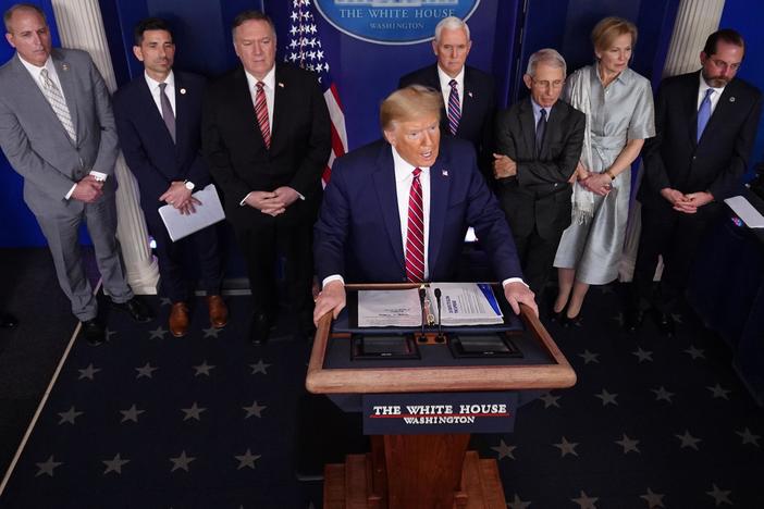 More states lock down residents as Trump defends virus response