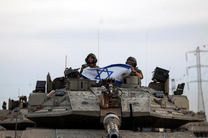 Hospitals overwhelmed as Gaza siege intensifies and Israel vows Hamas will 'be crushed'