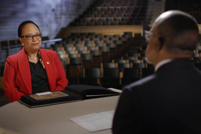 Dr. Jackson views the 1836 estate records listing the names of her enslaved ancestors.