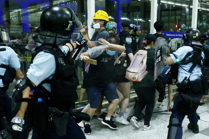 News Wrap: Hong Kong’s airport again crippled by protests
