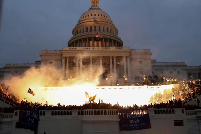 Photojournalists share the stories behind images that defined 2021