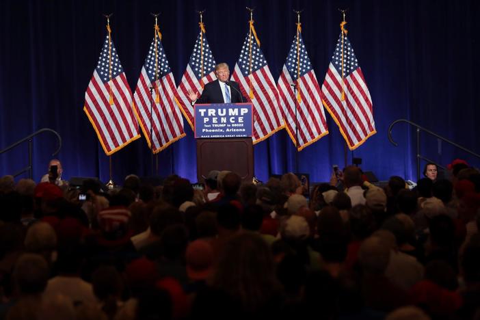 Trump visits Mexico and repeats his strict immigration policies in Arizona.