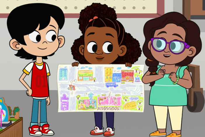 Lyla, Ale, and Everett build a model of their neighborhood for community day.
