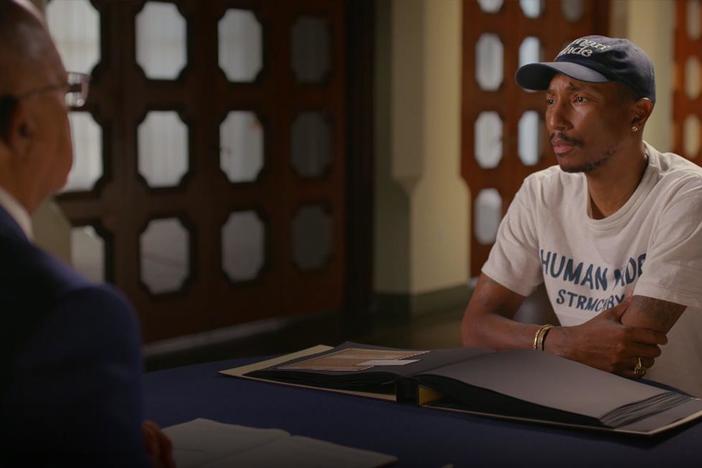 Pharrell Williams learns of the dark history behind his surname.