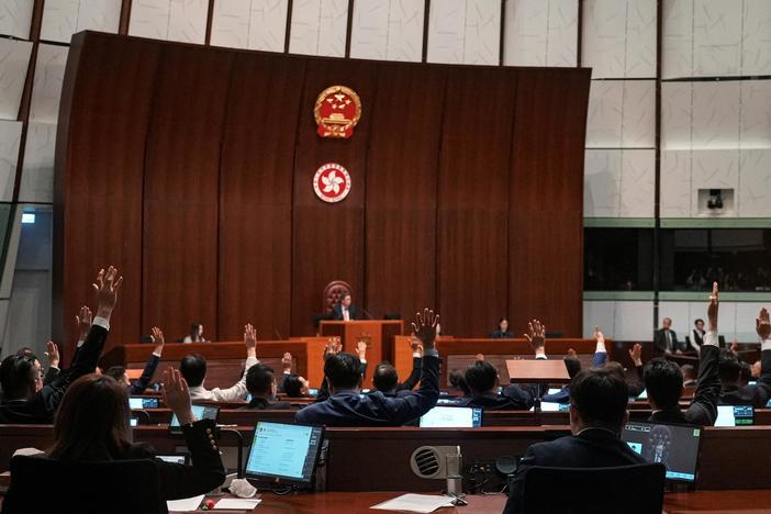 China tightens grip on Hong Kong with passage of strict law punishing dissent