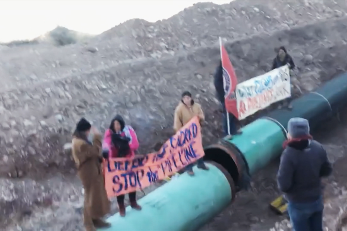 Behind the scenes footage of activists protesting the construction of a pipeline.