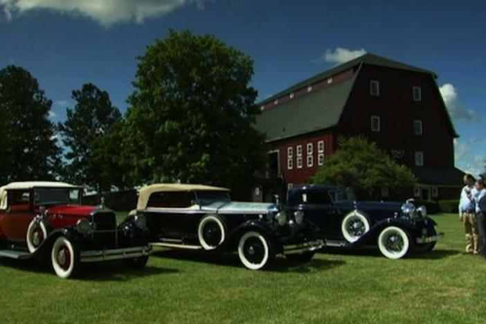At the Gilmore Car Museum, Eric Silver talks antique car mascots with Mark L. Walberg.