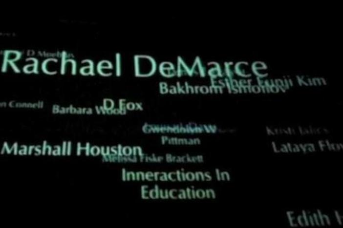 Student Freedom Rider Rachael DeMarce places her name on the Wall of Tolerance.