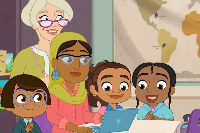 Safina shows the girls how she created her video with the magic of editing.