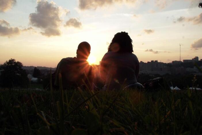 The Klouste family enjoys being in the park together and watching the sunset.