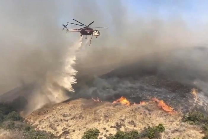 Southern California endures new flames as PG&E prepares to restore power in the north