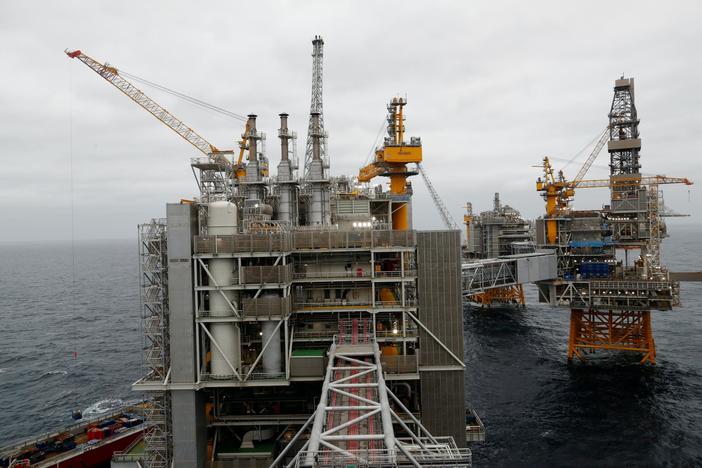 News Wrap: Oil producers agree to cut global supply