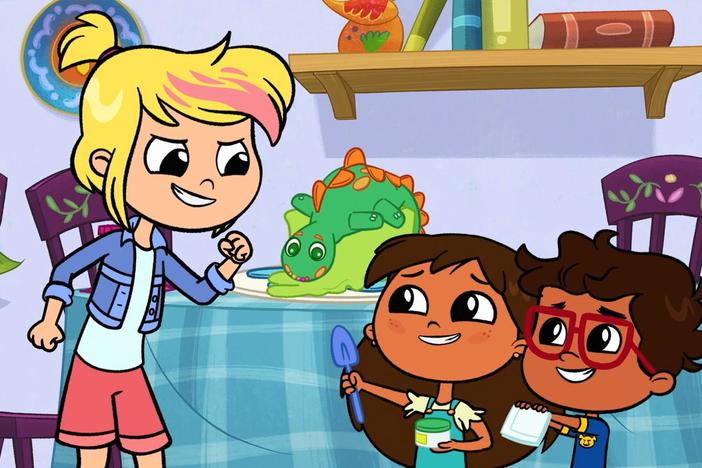 Javi and Rosie enlist Crystal to help fix Iggy’s dino cake.