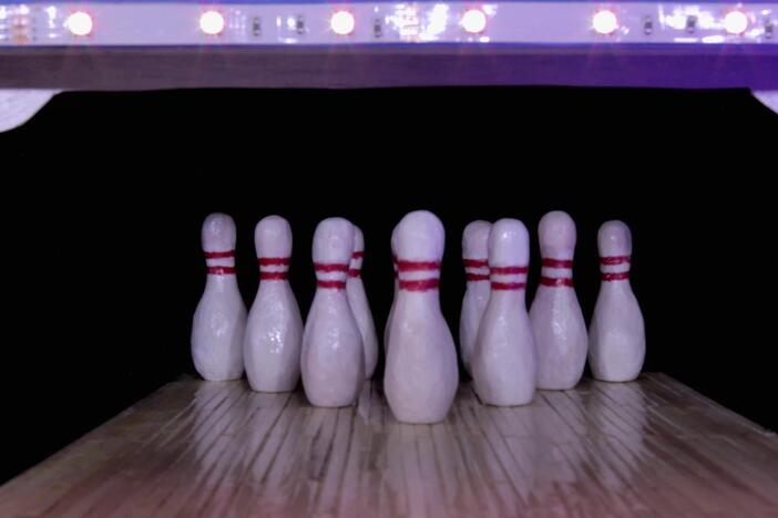 An animation of bowling balls practicing while learning about the letter B!