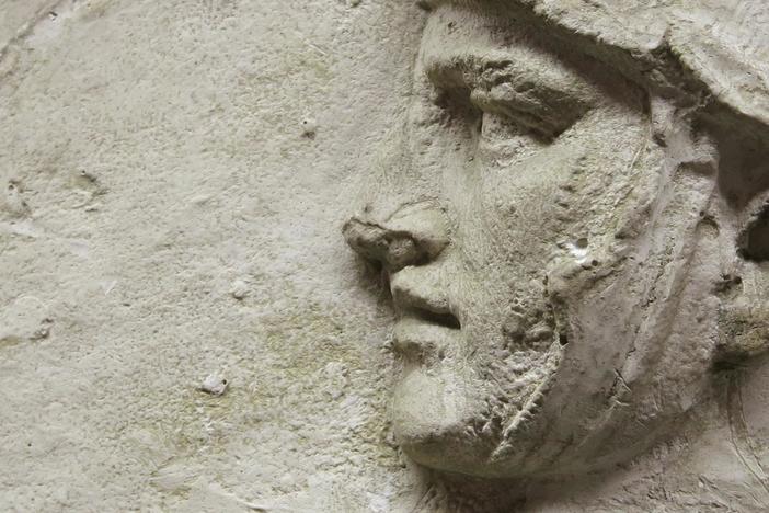 Who or what killed hundreds of people hidden in a burial chamber nearly 2,000 years ago? 